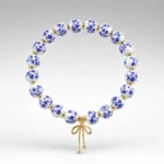 Blue Ceramic Bow Bracelet – Gold Tone main image